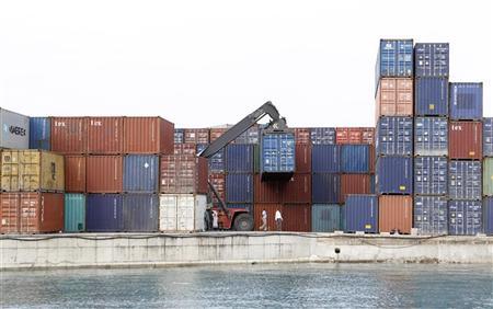 A crane arranges containers at the Port of Zanzibar on the island of Zanzibar July 19, 2012.