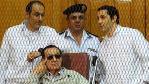 Alaa (R) and Gamal (L) Mubarak, seen here with their father, are also facing separate allegations