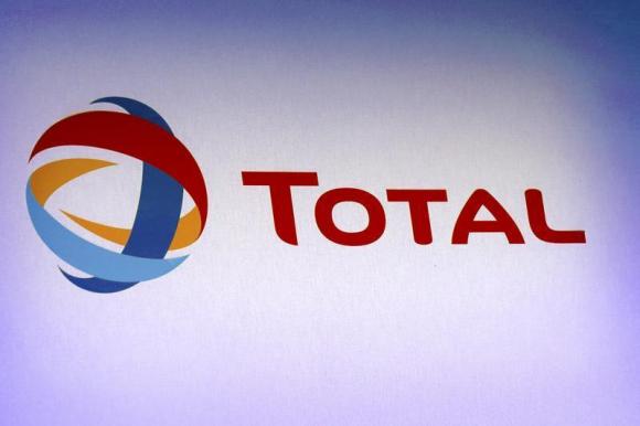 The logo of French oil company Total is pictured during the company's 2012 annual result presentation in Paris February 13, 2013. REUTERS/Philippe Wojazer