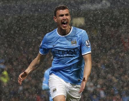 Manchester City's Edin Dzeko celebrates after scoring a goal against Aston Villa during their English Premier League soccer match at the Etihad Stadium in Manchester, northern England May 7, 2014. REUTERS/Phil Noble