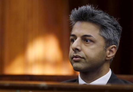 Honeymoon murder accused Shrien Dewani sits in the dock before the start of his trial in Cape Town, October 6, 2014. B REUTERS/Mike Hutchings