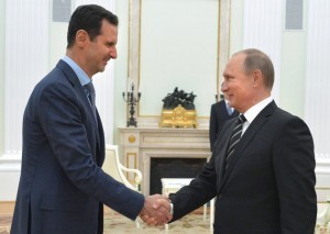 In this photo taken on Tuesday, Oct. 20, 2015, Russian President Vladimir Putin, right, shakes hand with Syrian President Bashar Assad in the Kremlin in Moscow, Russia. President Bashar Assad was in Moscow, in his first known trip abroad since the war broke out in Syria in 2011, to meet his strongest ally Russian leader Putin. The two leaders stressed that the military operations in Syria - in which Moscow is the latest and most powerful addition - must lead to a political process. (Alexei Druzhinin, RIA-Novosti, Kremlin Pool Photo via AP)