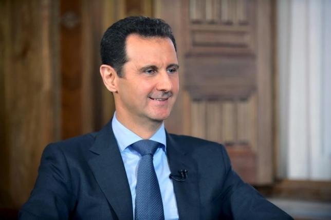 Syria's President Bashar al-Assad answers questions during an interview with al-Manar's journalist Amro Nassef, in Damascus, Syria, in this handout photograph released by Syria's national news agency SANA on August 25, 2015.  REUTERS/SANA/Handout via Reuters
