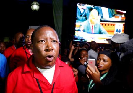 Economic Freedom Fighters (EFF) leader Julius Malema leaves the parliament after being ordered to do so during President Jacob Zuma's State of the Nation address in Cape Town, February 11, 2016.  REUTERS/Mike Hutchings
